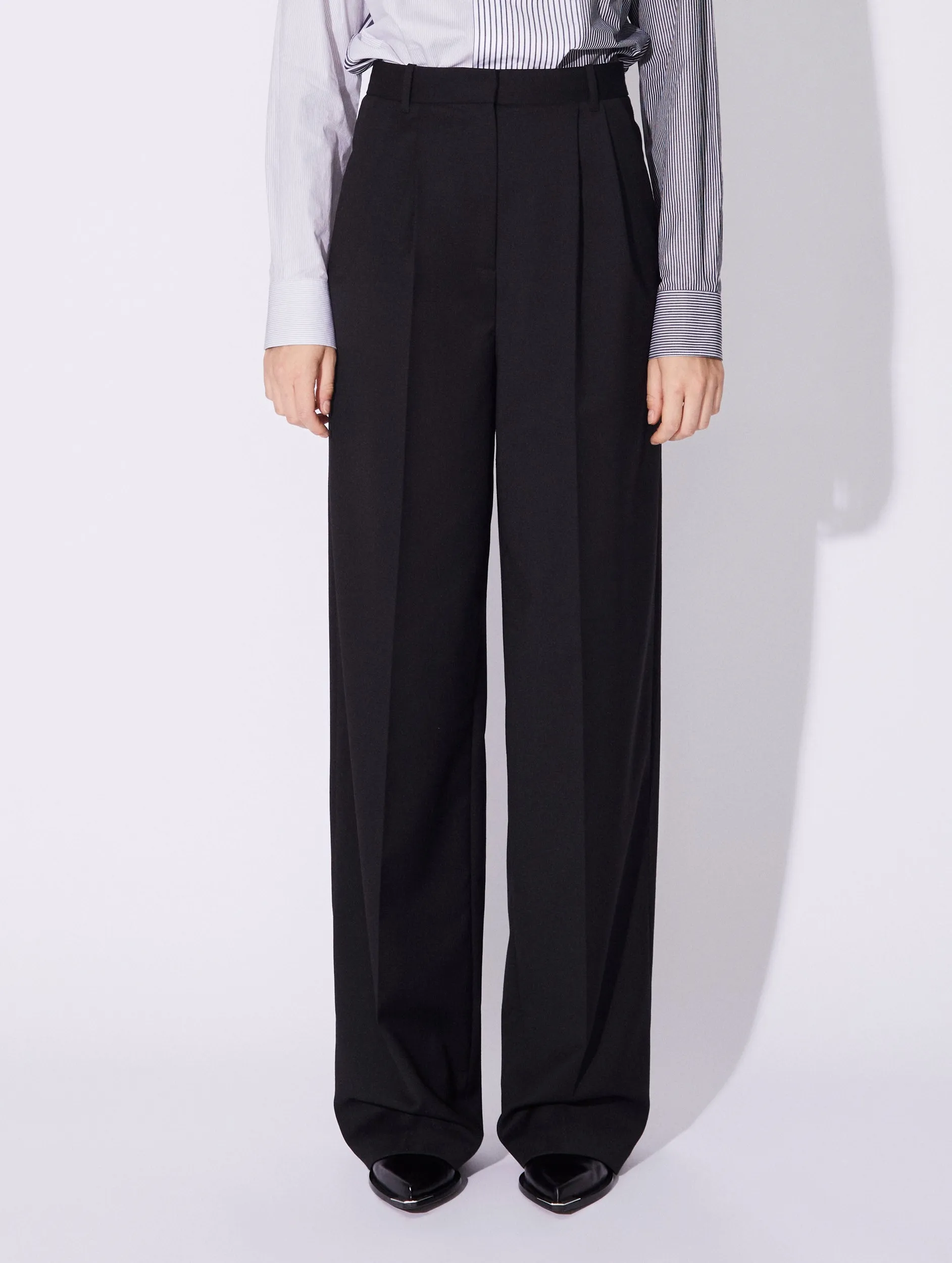 Black stretch wool high waisted pleated trousers