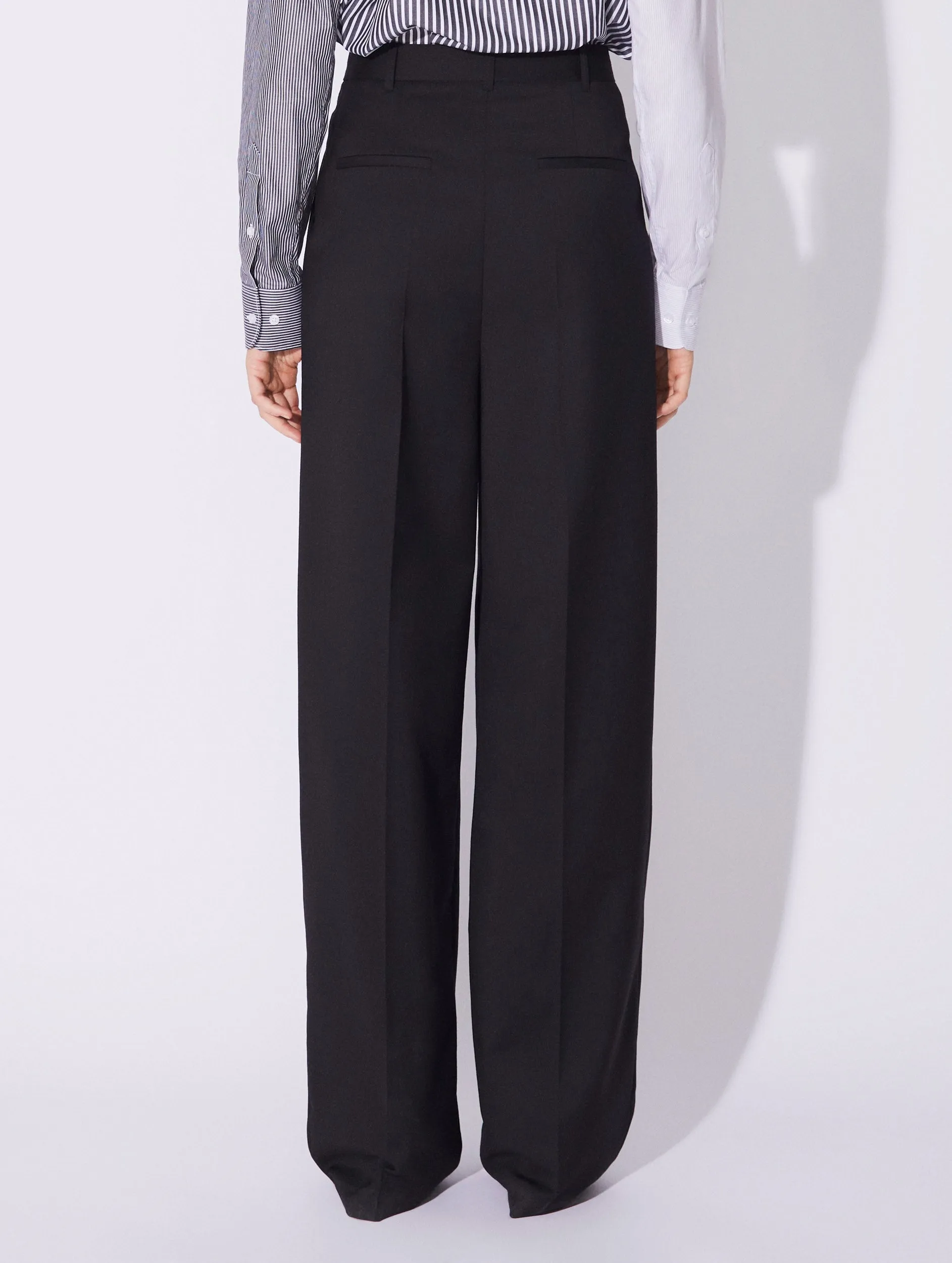 Black stretch wool high waisted pleated trousers